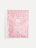 Pink skincare sheet mask with Dermovia branding on a white background