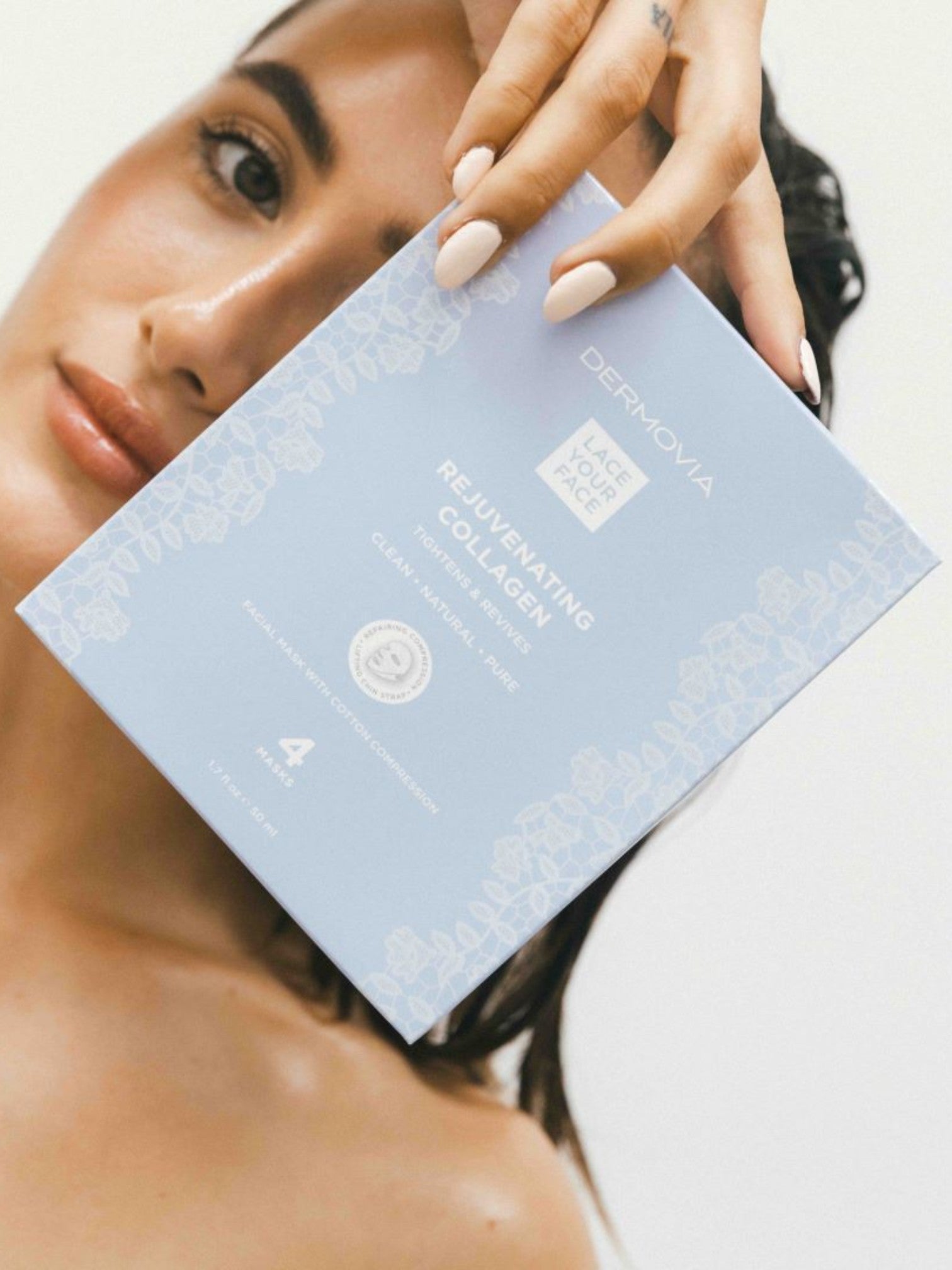 Woman holding a box of Dermalogica Rejuvenating Collagen masks against a neutral background