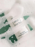 Skincare product from Dermovia skin cycle on a soapy background