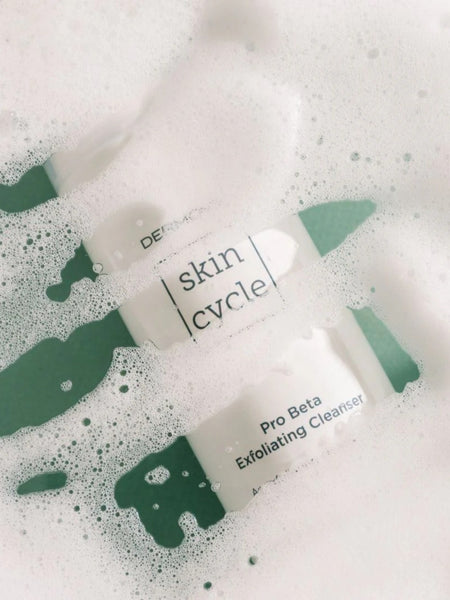 Skincare product from Dermovia skin cycle on a soapy background