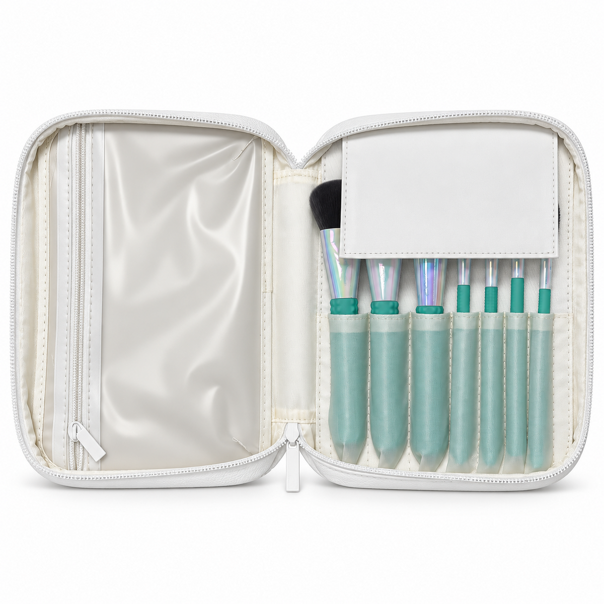 Seven makeup brushes organized inside the open white vegan leather carrying case